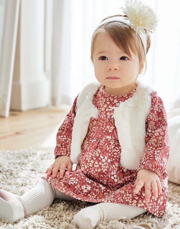 Cotton, floral dress combined with a fur vest. (0 - 12 Months)